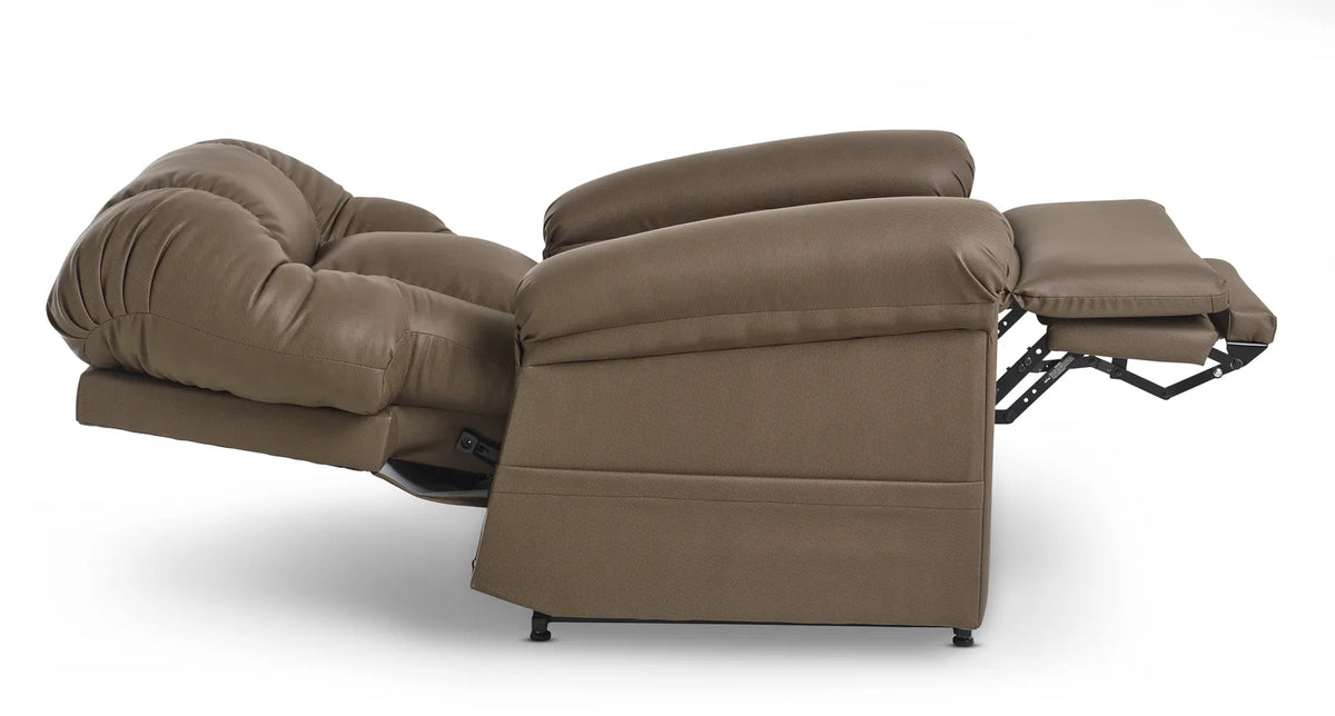 The chair from the side laid out flat, the back dropped level with the seat and the footrest extended, forming one continuous surface from the headrest to the toe.